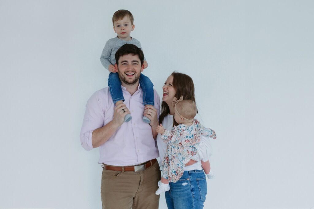 A heartwarming photo capturing a family's journey with braces at Razz Orthodontics, each member proudly revealing their transformed smiles.