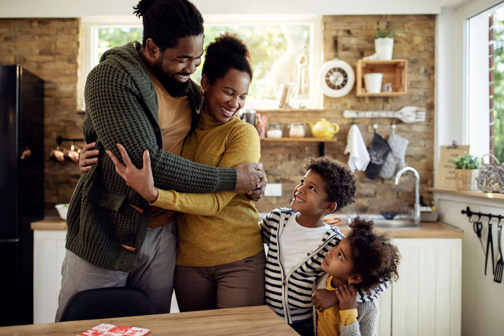 Happy family take on their kitchen room